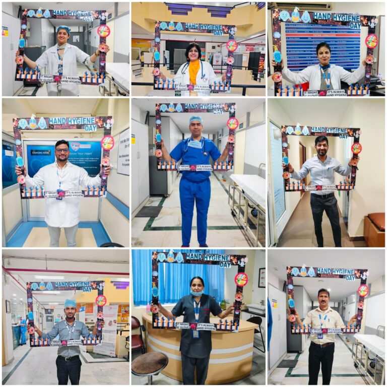 ACE Heart Institute team members with hand hygiene educational displays.